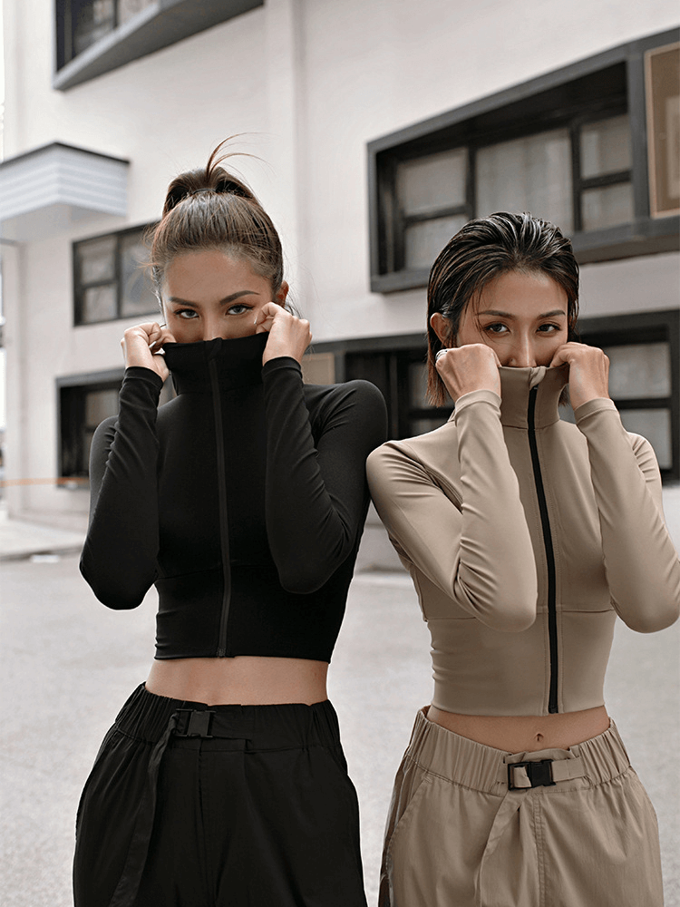 Two women modeling black and khaki Sports Women's Zipper Elasticity Jackets, ideal for running and fitness, with stylish Mandarin collars.